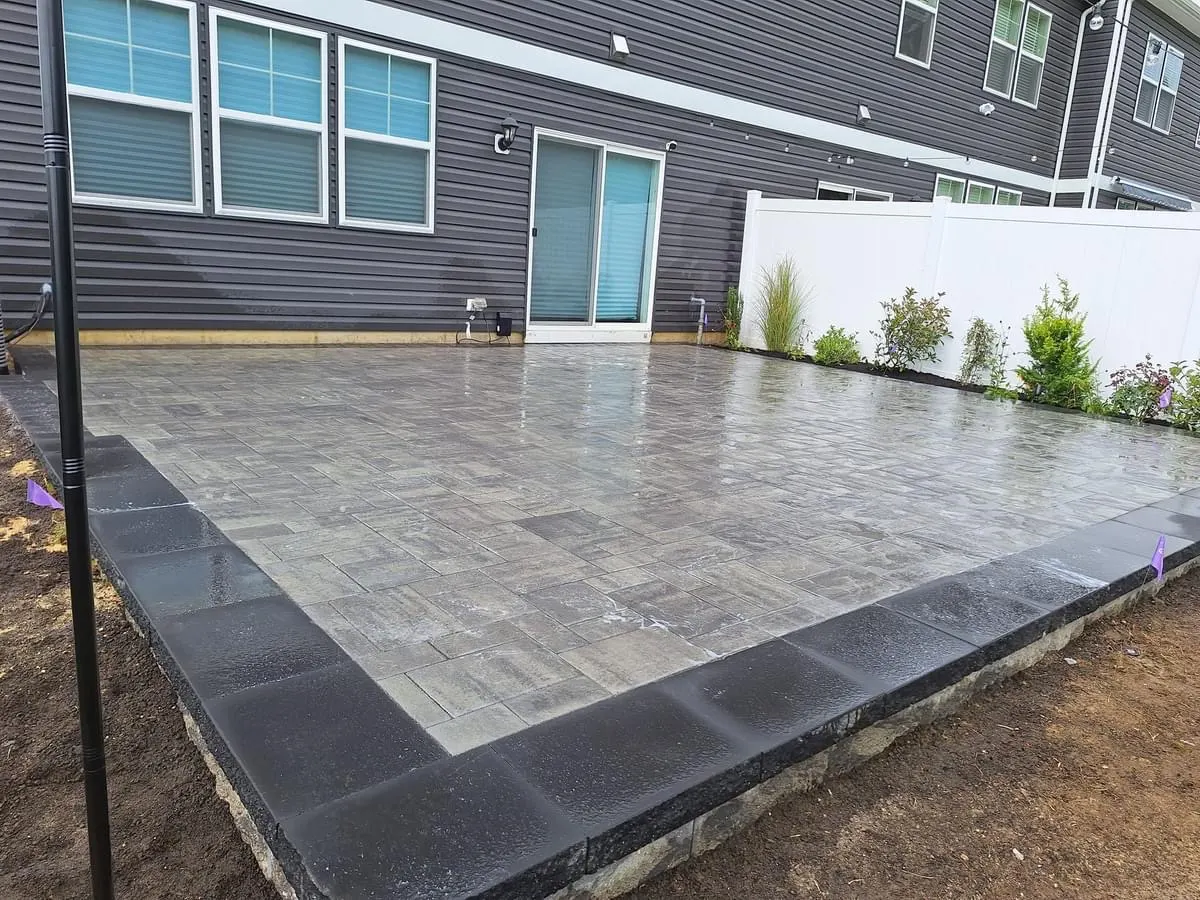 Gray Paver Patio Finished by Down To Earth Landscaping.