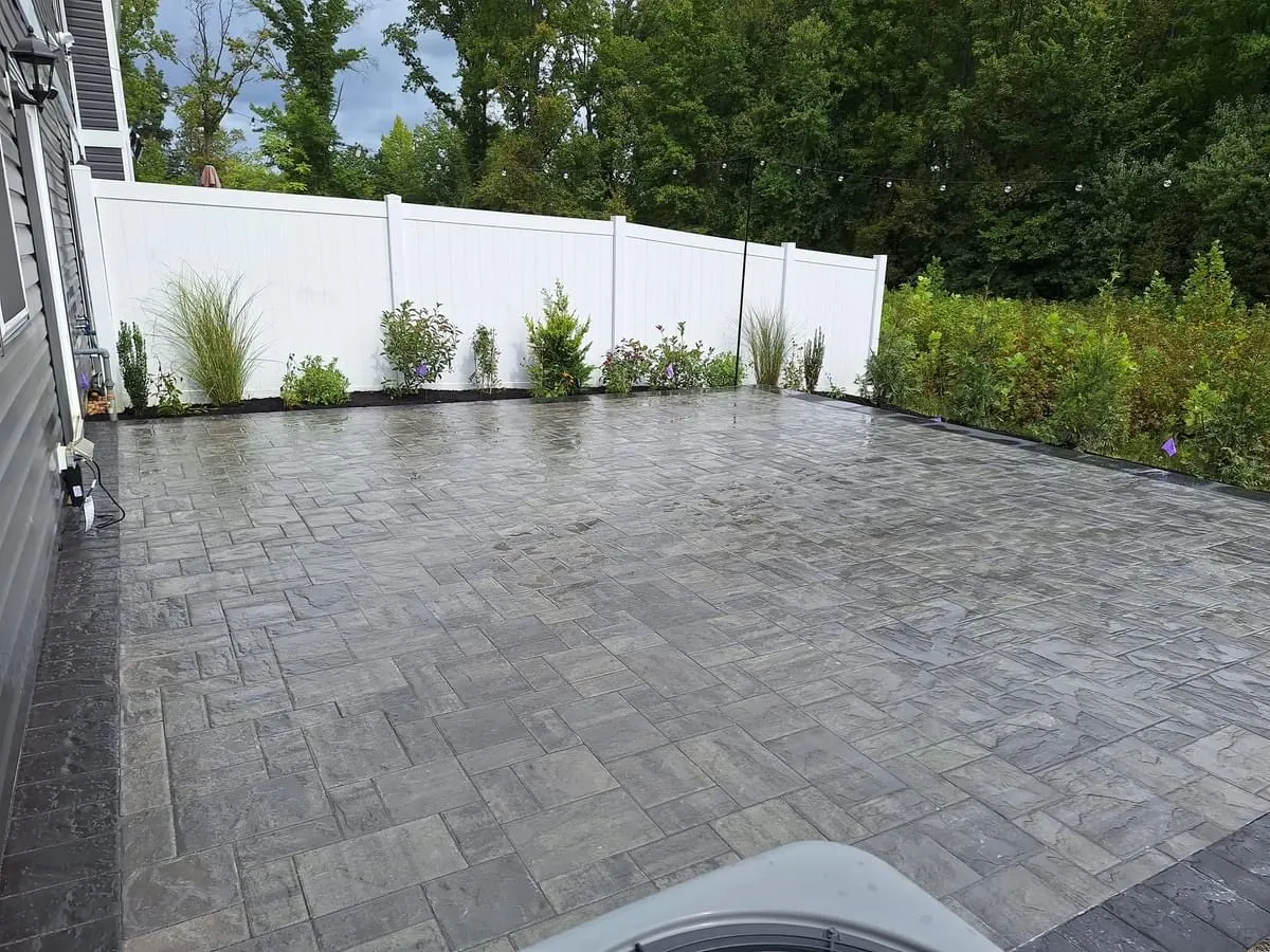 Gray Paver Patio Finished by Down To Earth Landscaping.
