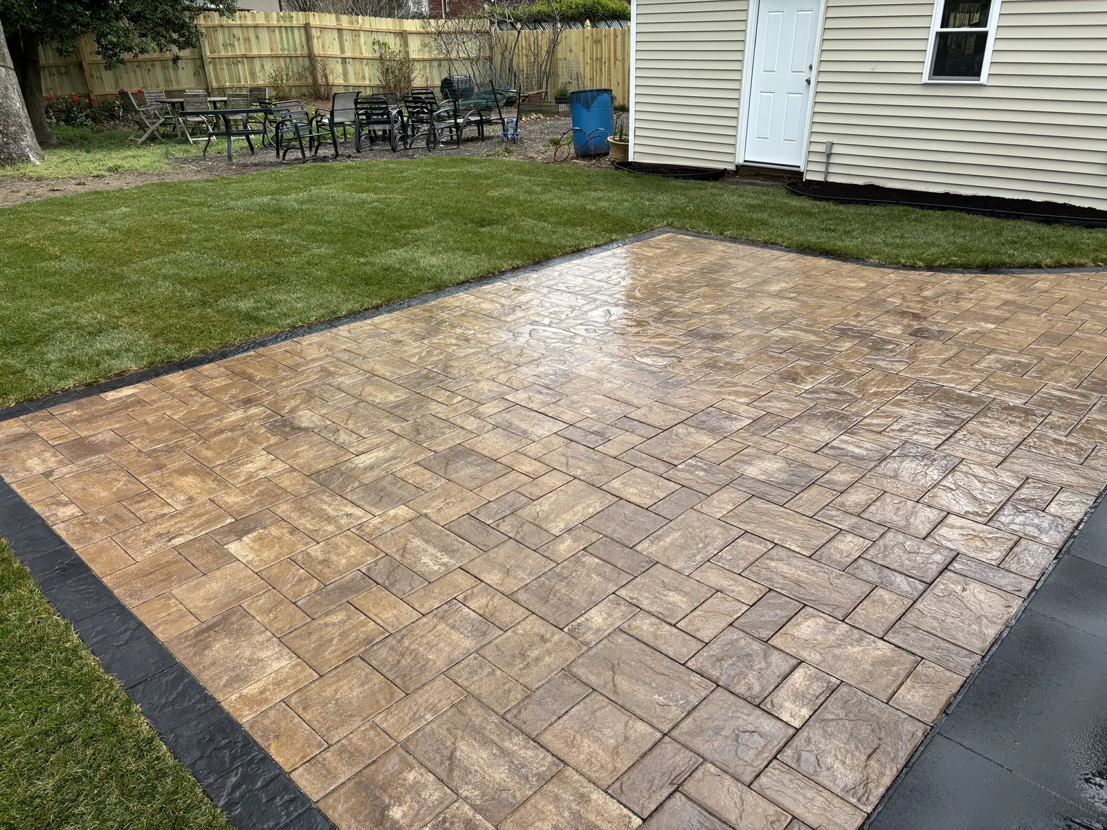 Paver Patio And Sod Finished by Down To Earth Landscaping.