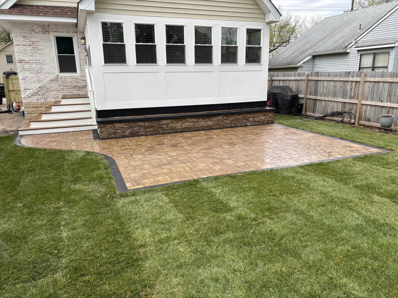 Paver Patio Backyard Finished by Down To Earth Landscaping.