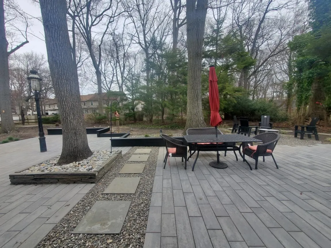 Paver Patio Outdoor Table by Down To Earth Landscaping.