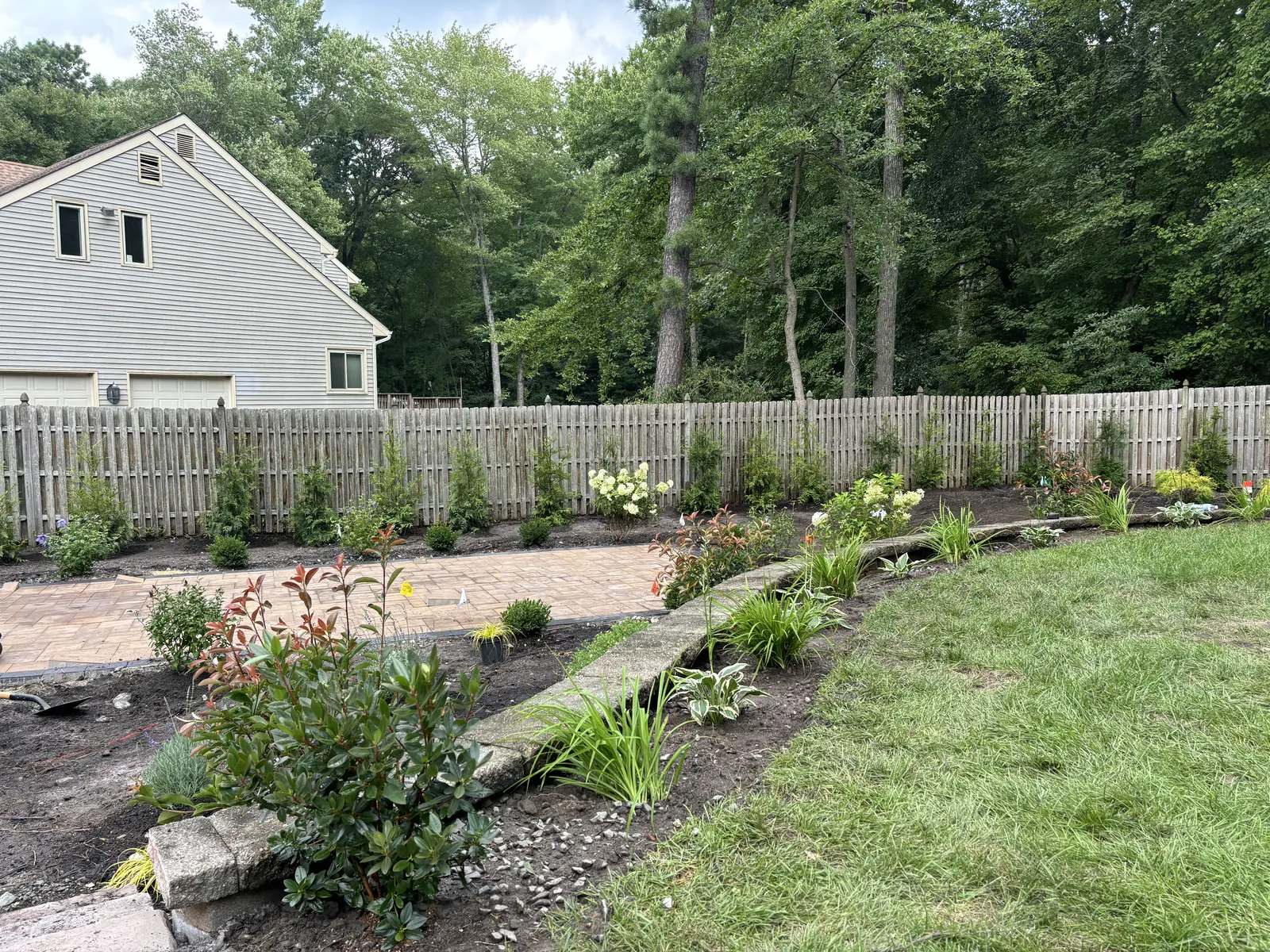 Backyard Garden Installation by Down To Earth Landscaping.