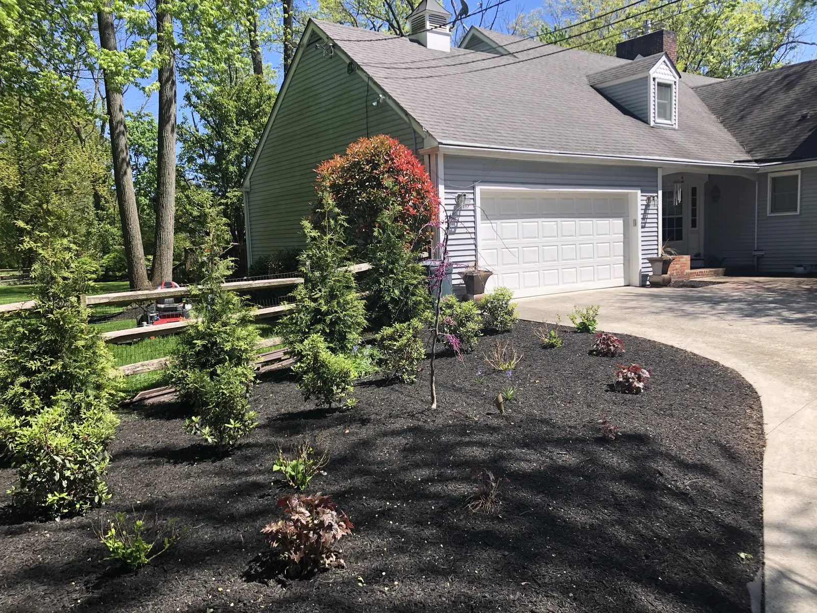 Driveway Planting Design by Down To Earth Landscaping.