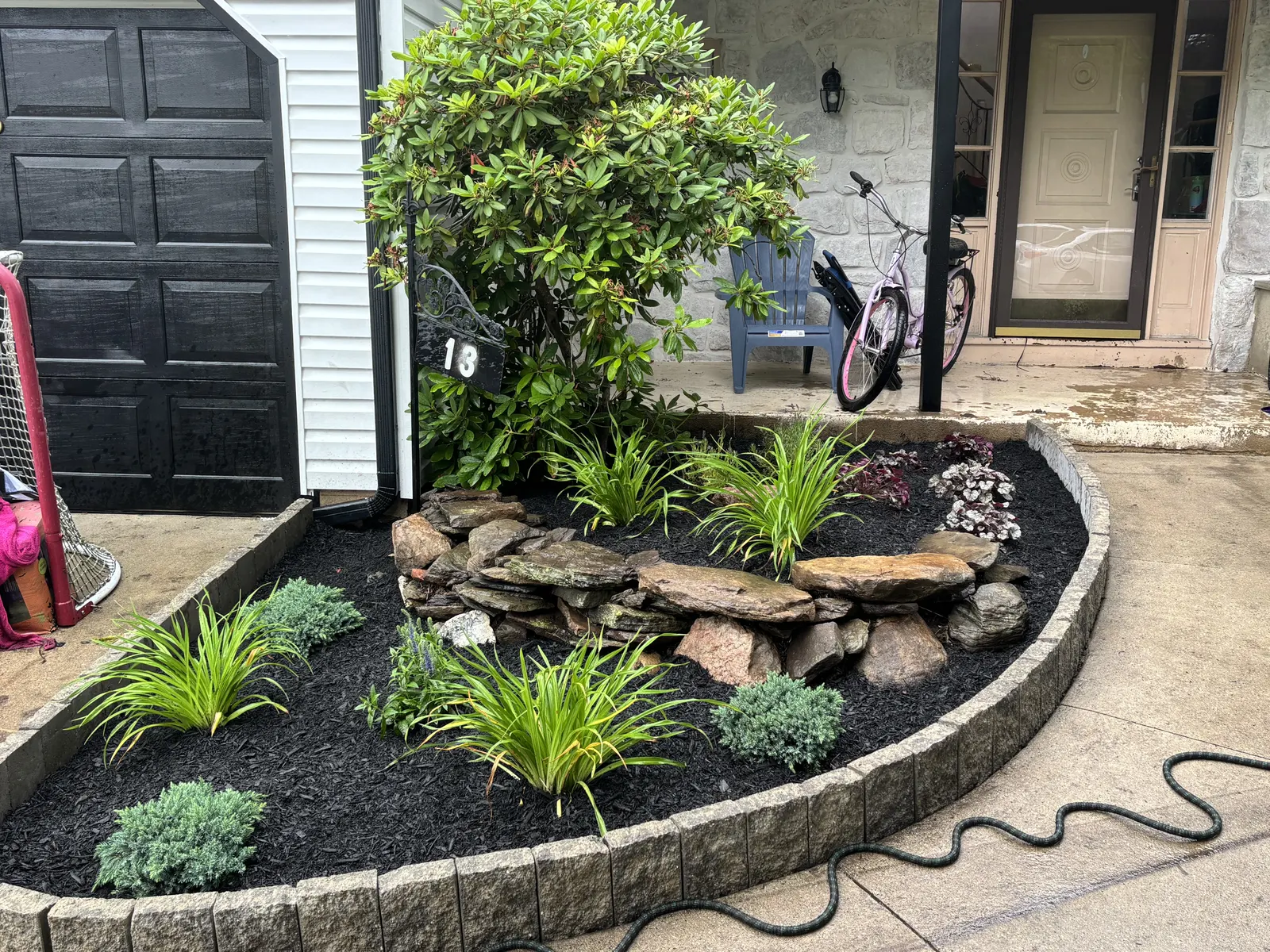 Front Yard Stone Garden by Down To Earth Landscaping.