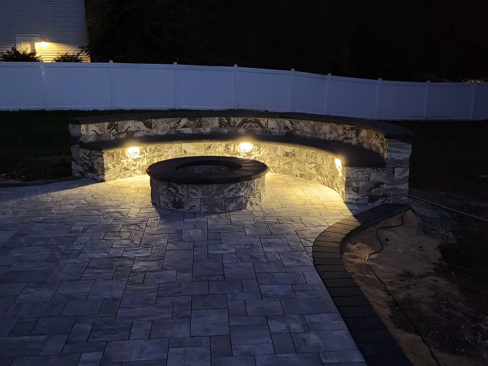 Fire Pit Wall Lighting by Down To Earth Landscaping.