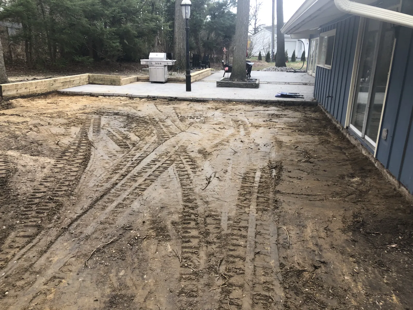 Patio Site Grading by Down To Earth Landscaping.