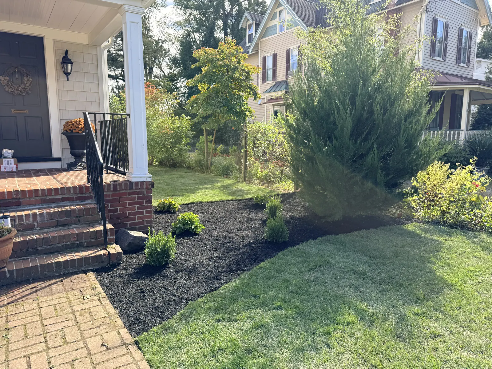 Front Lawn And Mulch Finished by Down To Earth Landscaping.