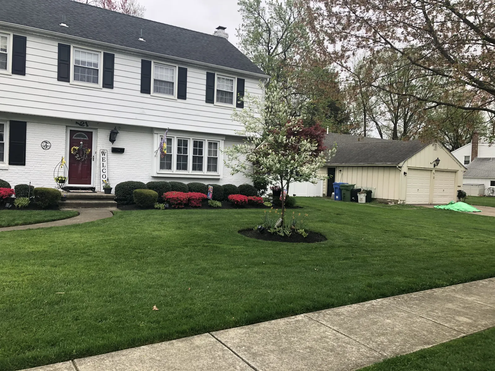 Front Lawn Maintenance by Down To Earth Landscaping.