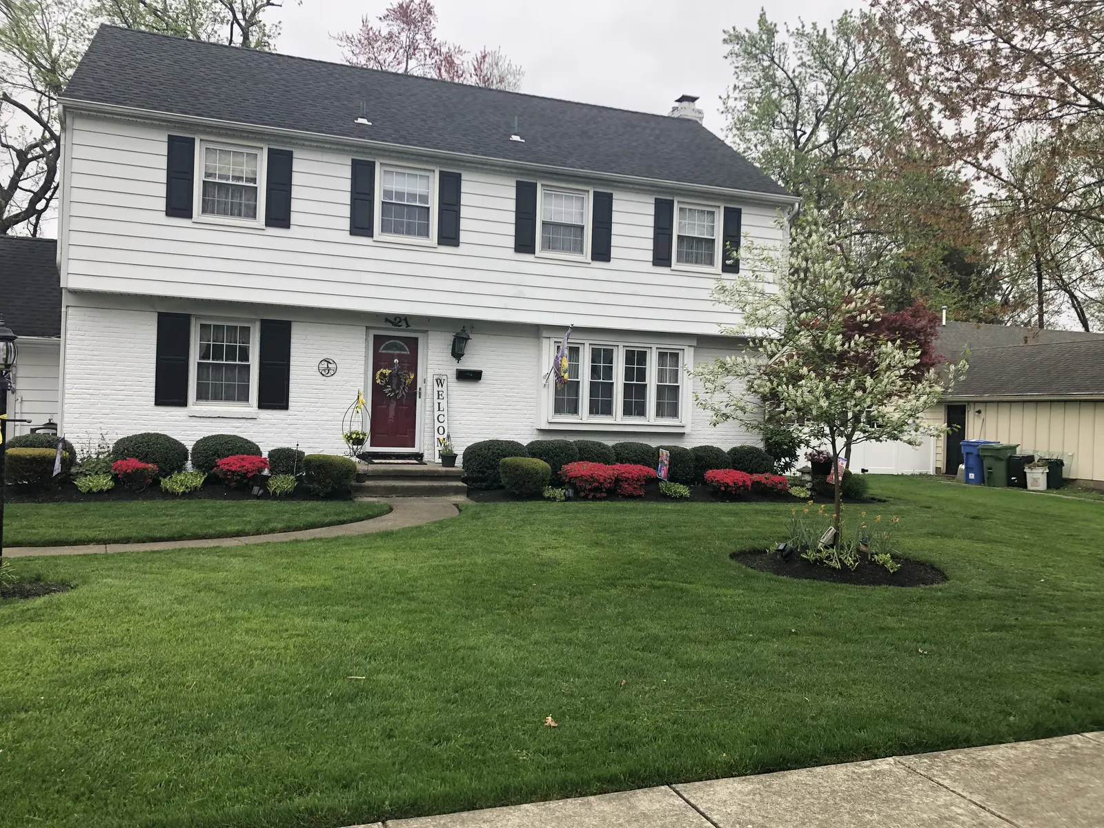 Front Lawn Maintenance by Down To Earth Landscaping.