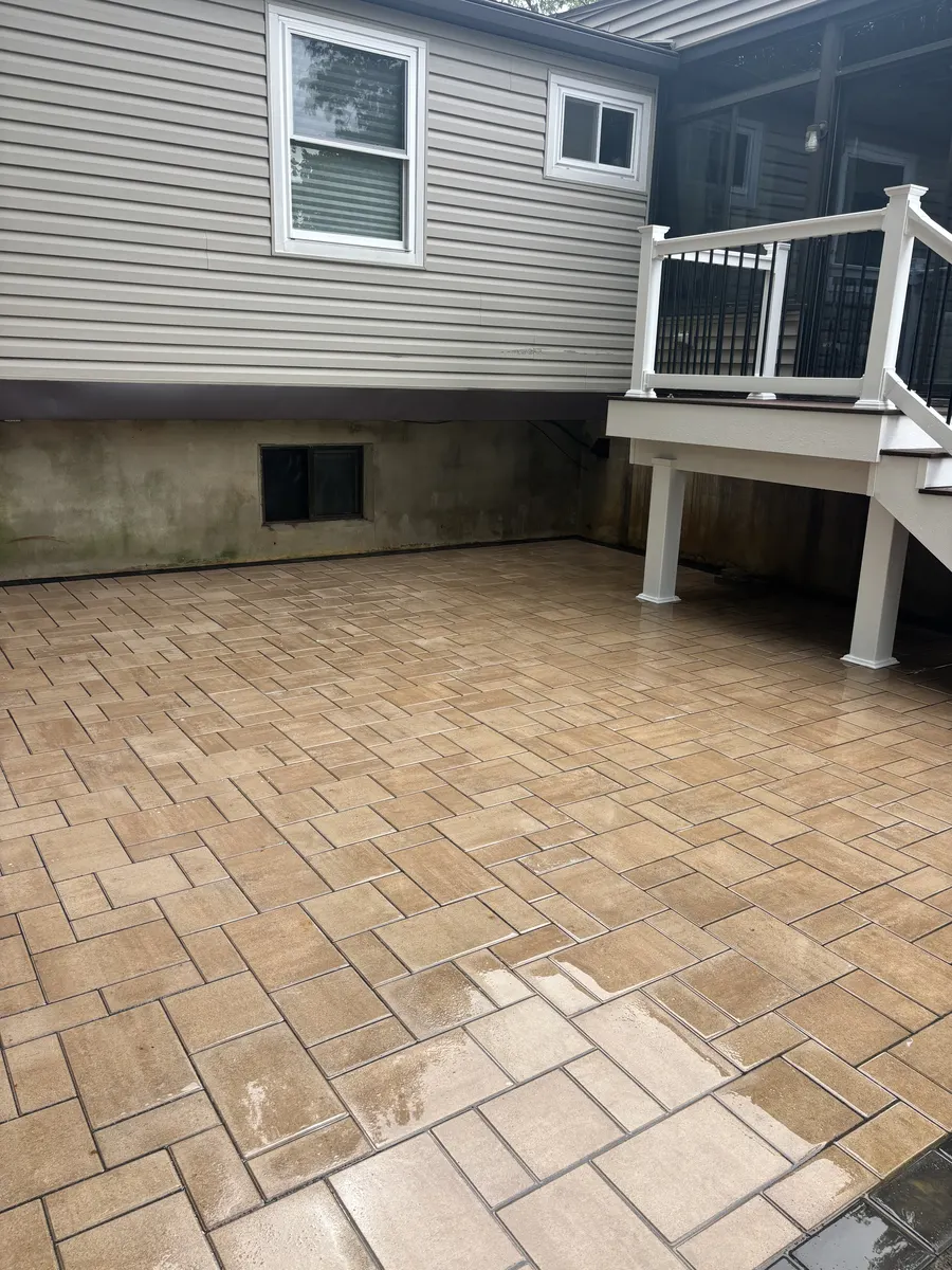 Covered Patio Outdoor Room by Down To Earth Landscaping.