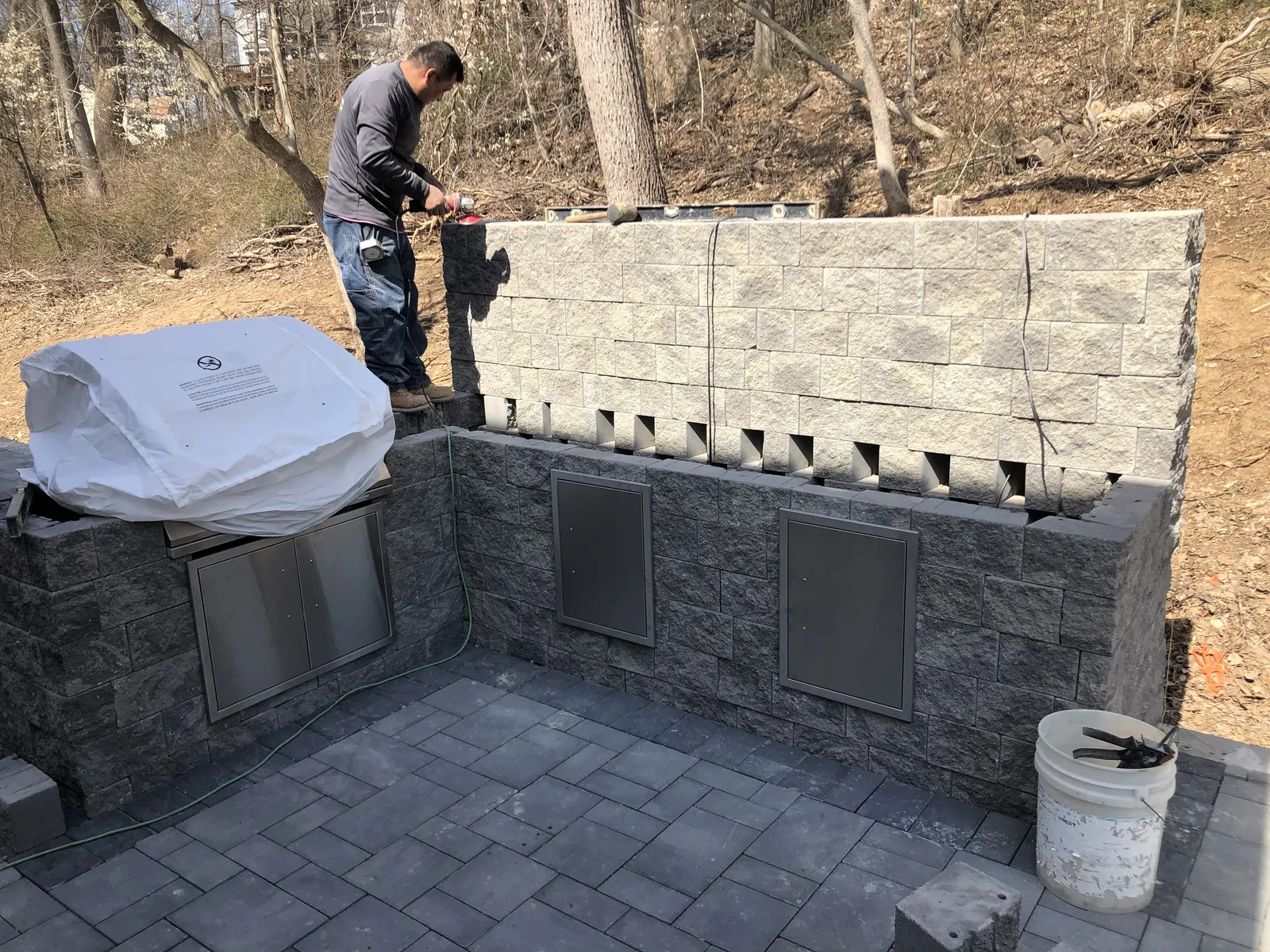 Outdoor Kitchen Stonework by Down To Earth Landscaping.