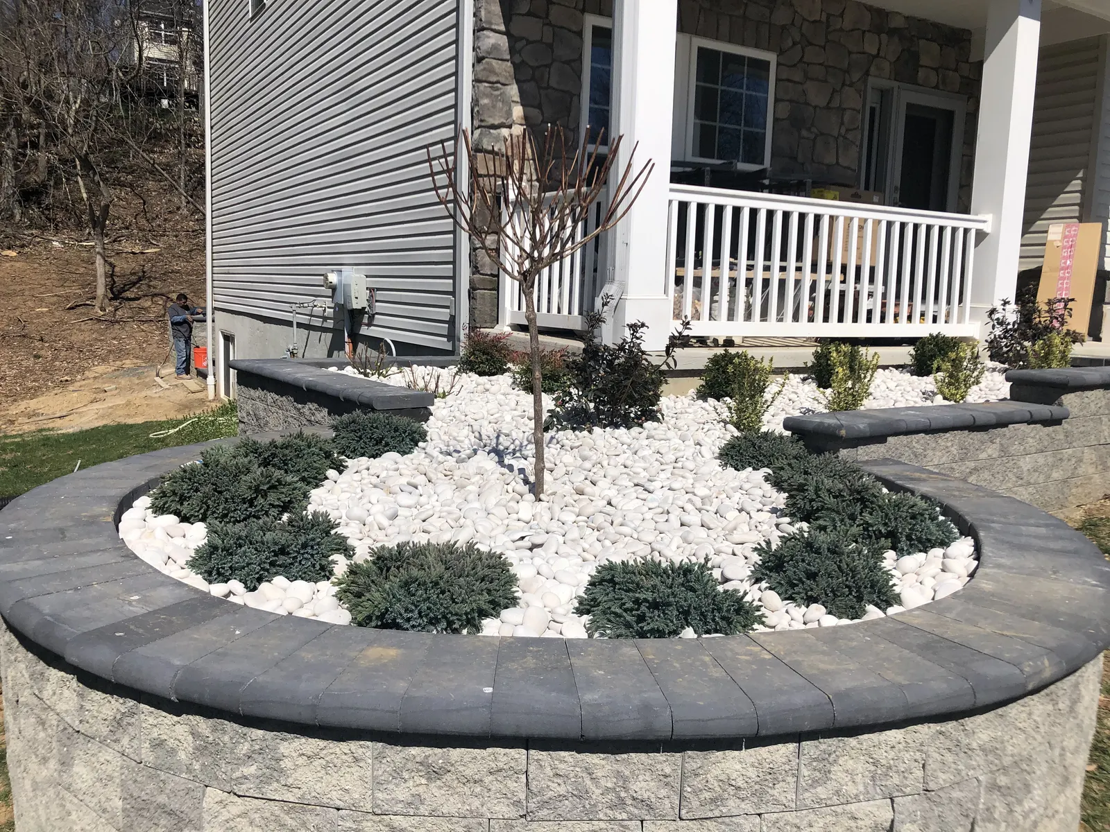 Raised Wall Front Bed Finished by Down To Earth Landscaping.