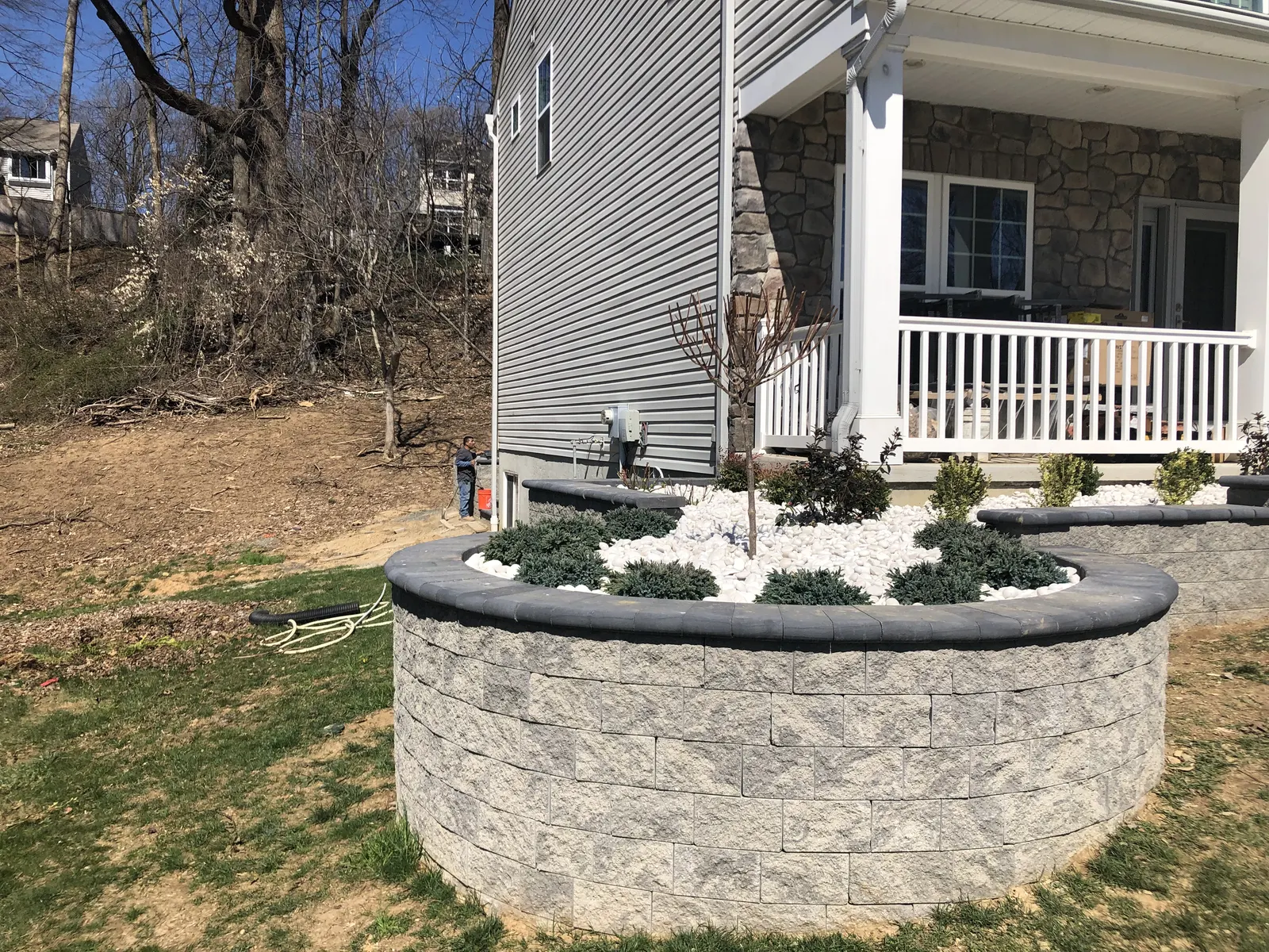 Raised Wall Front Bed Finished by Down To Earth Landscaping.
