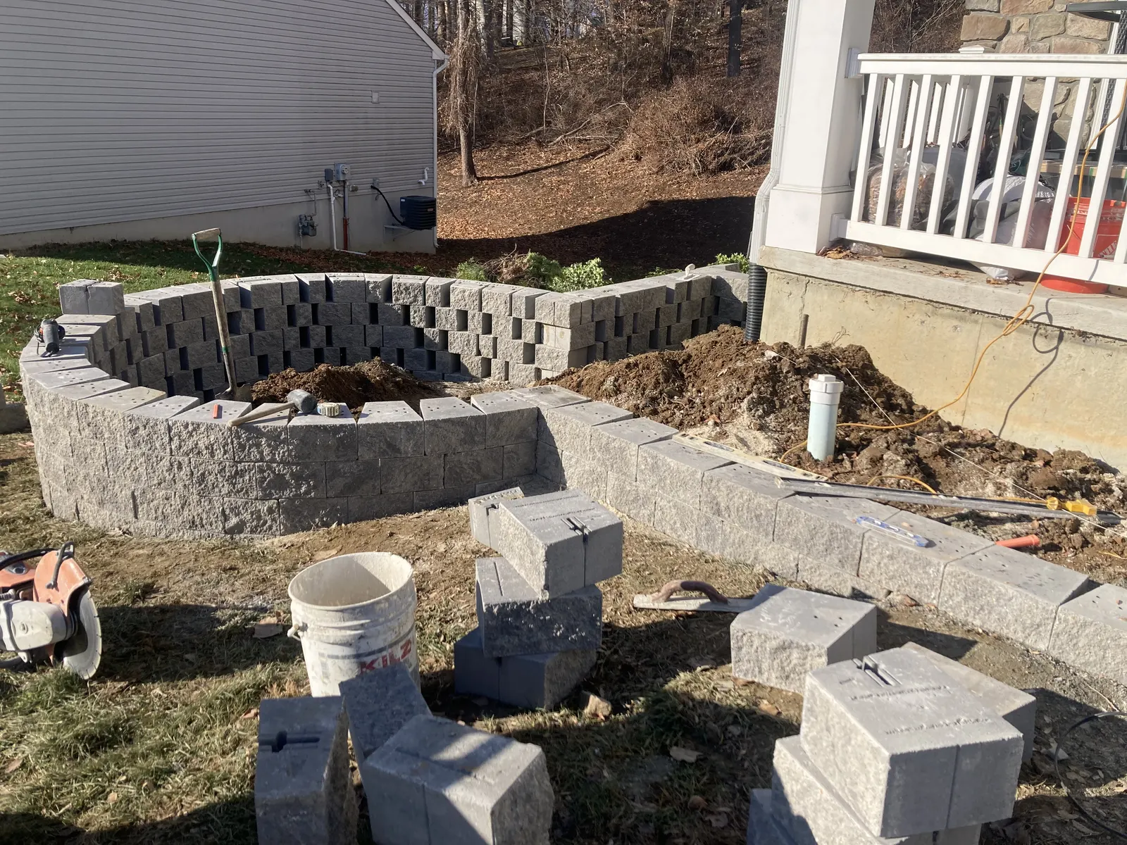 Raised Wall Front Bed Installation by Down To Earth Landscaping.