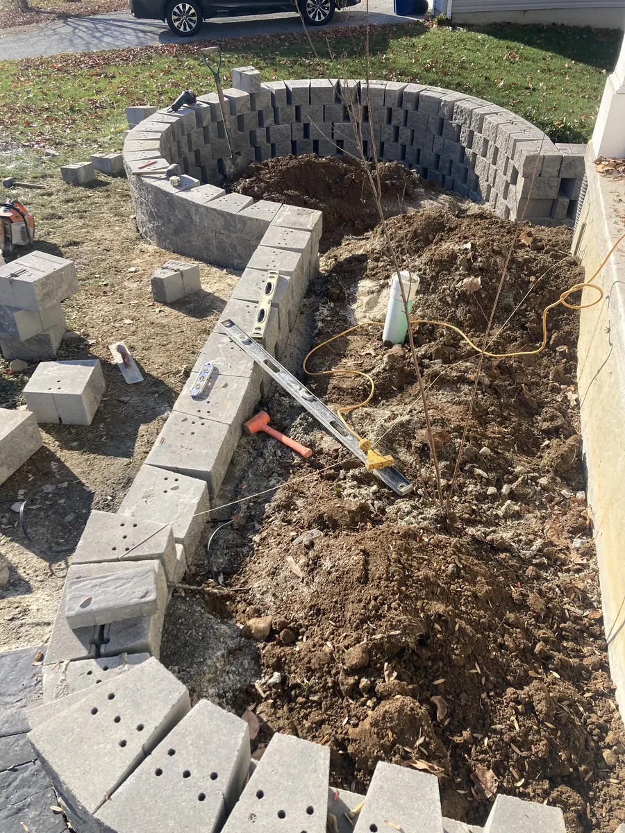 Raised Wall Front Bed Installation by Down To Earth Landscaping.